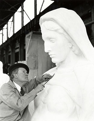 Sculptor James Earle Fraser refining Contemplation of Justice, May 1934. Born in Minnesota in 1876, Fraser studied at the Art Institute of Chicago and at the École des Beaux-Arts in Paris.